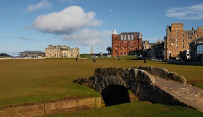 The Swilcan Bridge at St Andrews with the clubhouse behind it