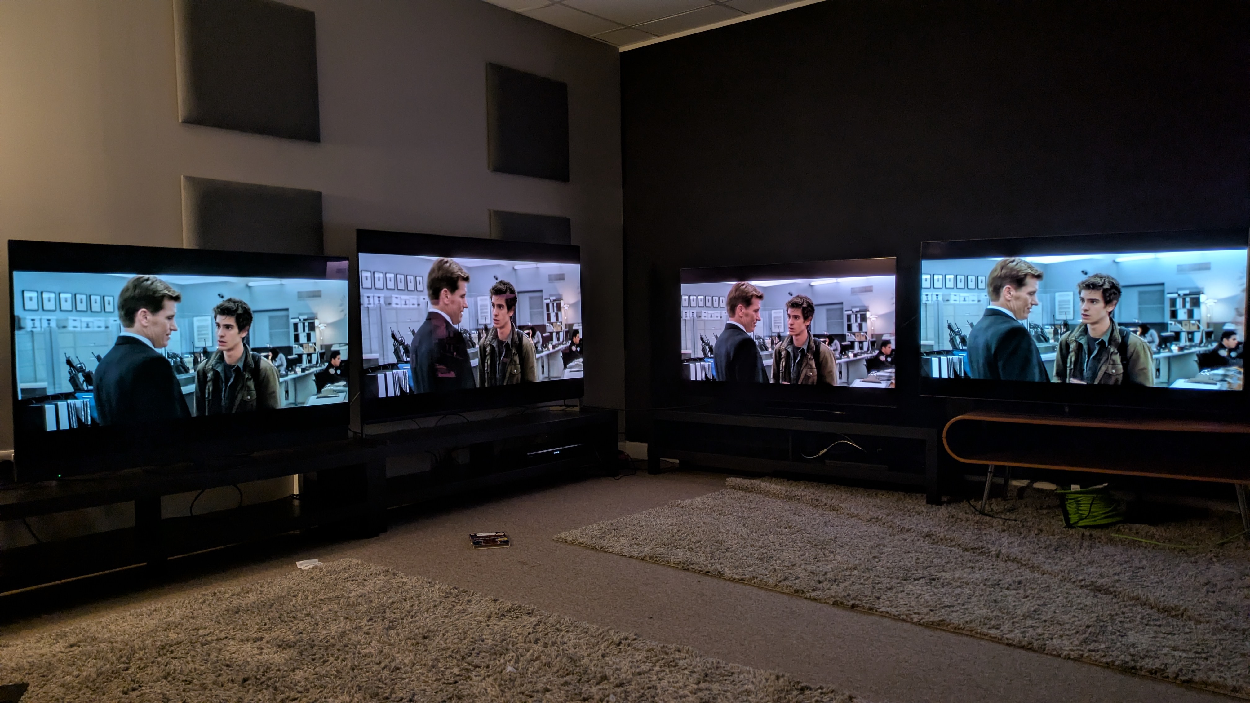 Panasonic Z95B (far left) Sony Bravia 8 II (middle left) Samsung S95F (middle right) LG G5 (far right) with The Amazing Spider-Man DVD on screen