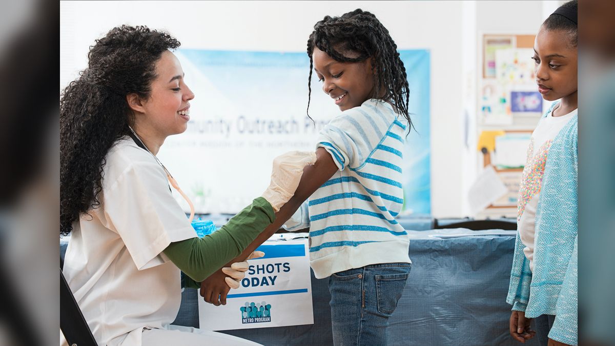 Children line up to get their annual flu shot.