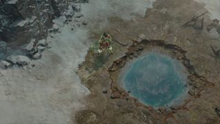 Diablo 4 secret of the spring player character looking into thermal spring water