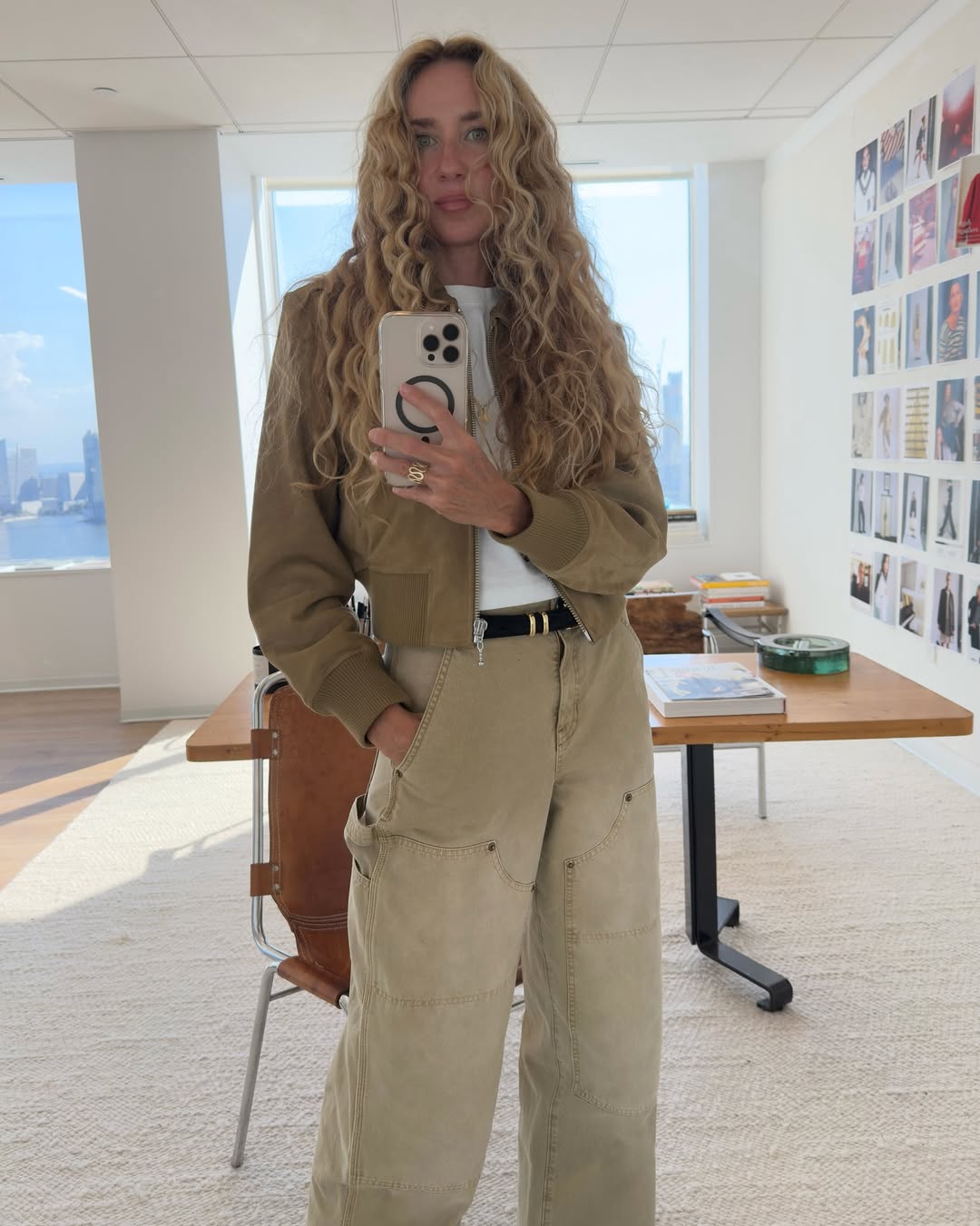 @olympiamarie wears brown jeans and brown jacket