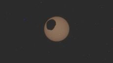 The moon Phobos passes in front of the sun in an image taken by the NASA Perseverance rover on Feb. 8, 2024.