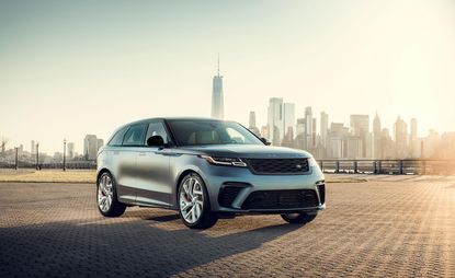 Range Rover Velar in gray photographed with a New York Skyline behind the car.