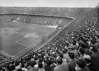 AC Milan and Inter in action in a derby at San Siro in the 1950s.