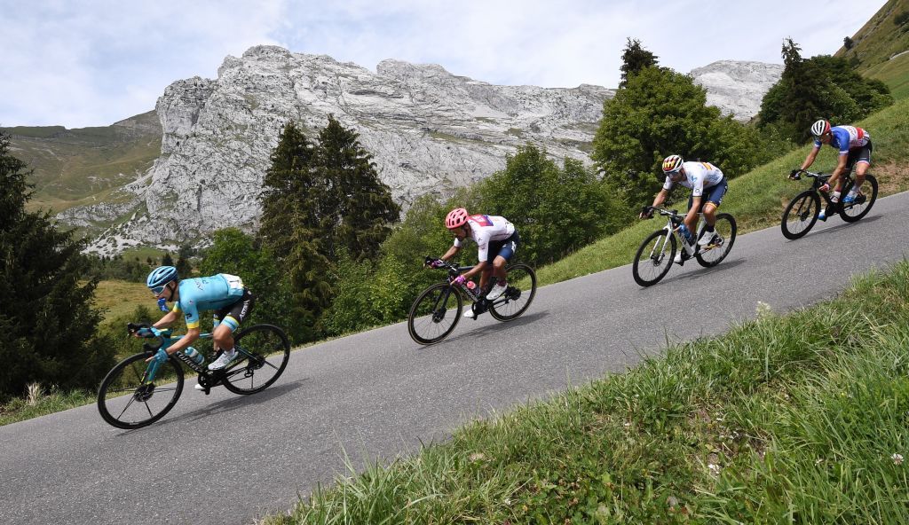 Team Astana rider Colombias Miguel Angel Lopez L rides on the downhill followed by Team Education First rider Colombias Daniel Martinez 2nd L Team Movistar rider Spains Alejandro Valverde and Team Arkea Samsic rider Frances Warren Barguil R during the fifth stage of the 72nd edition of the Criterium du Dauphine cycling race 153 km between Megeve and Megeve on August 16 2020 Photo by AnneChristine POUJOULAT AFP Photo by ANNECHRISTINE POUJOULATAFP via Getty Images