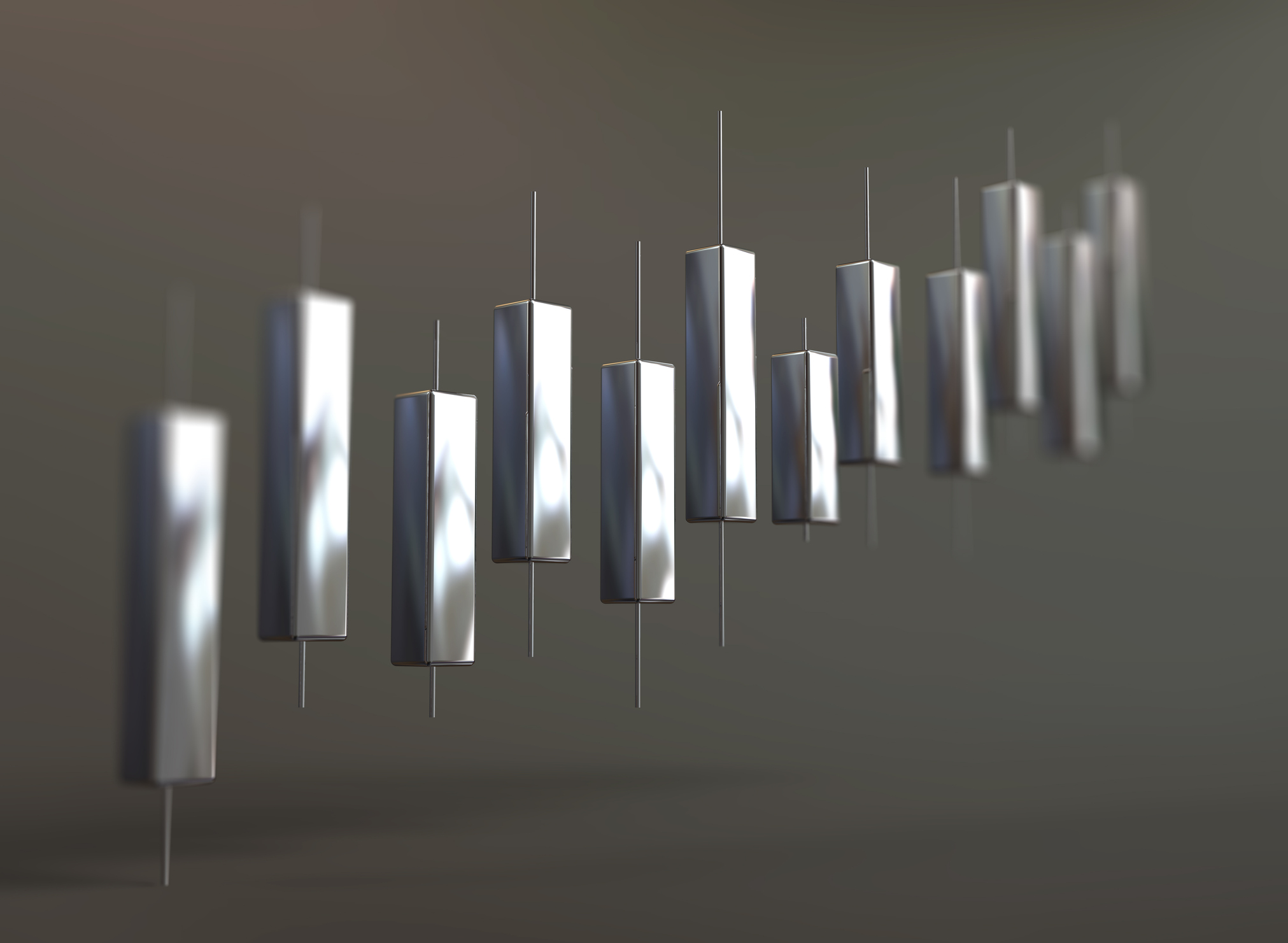Concept image of stock market chart with candlesticks formed by silver bars to represent silver investing