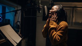 Lady singing in the studio