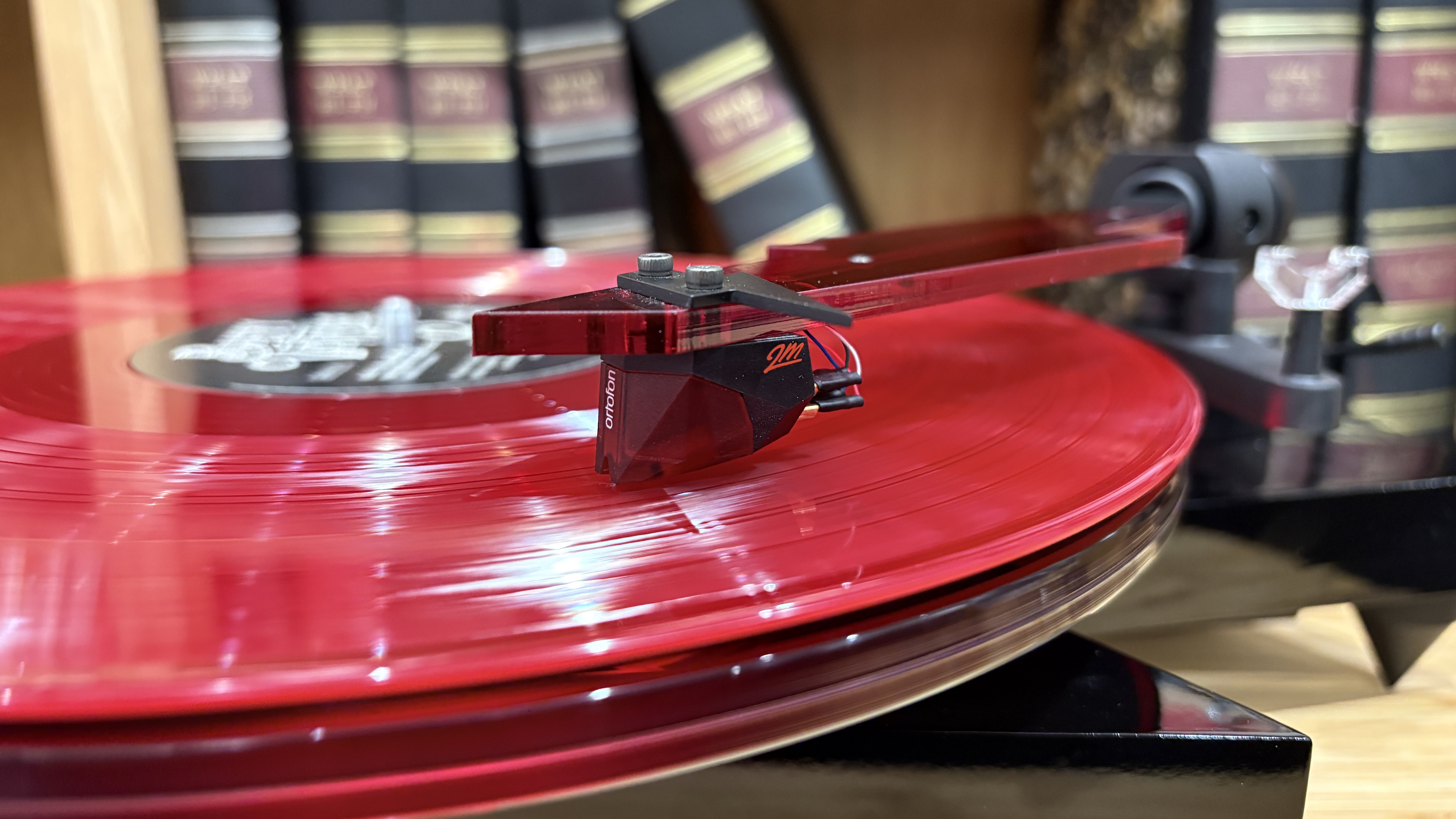 Pro-Ject AC/DC Turntable on wooden hi-fi rack