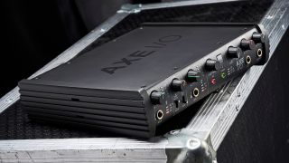 An IK Multimedia Axe I/O audio interface for guitar on a flight case