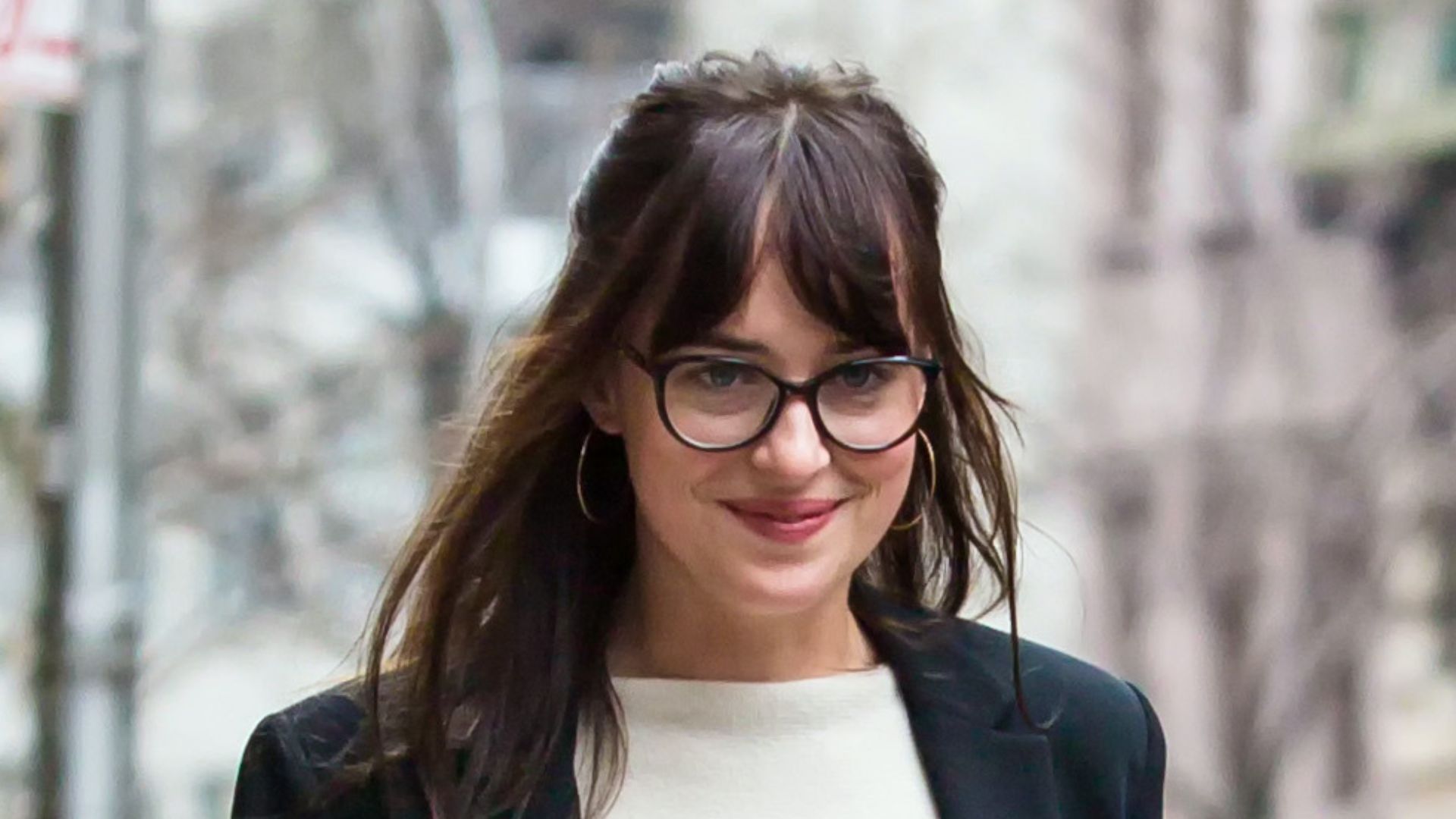Dakota Johnson wearing Dr Martens with jeans and black blazer in April, 2015