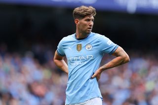 John Stones Manchester City star looks on in the Premier League match as he starts against Brentford