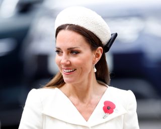 Kate Middleton wears cream with matching hatband