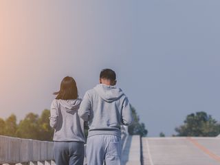 A couple jogging together.