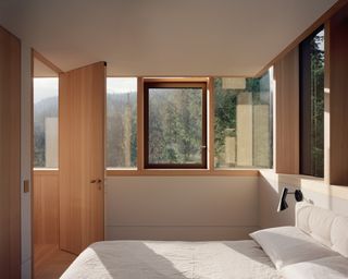 bedroom interior surrounded by nature at The Rock house by Gort Scott
