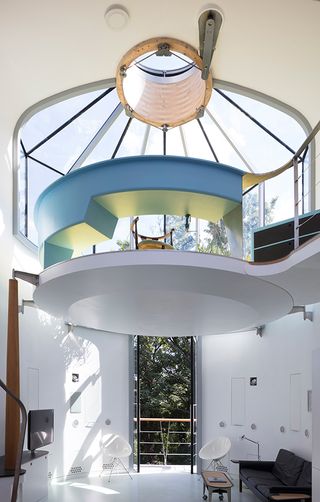 The floating conservatory at the top of the house and the open-plan living space below