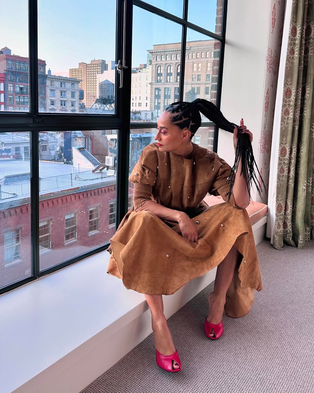 Tracee in brown suede dress and pink heels