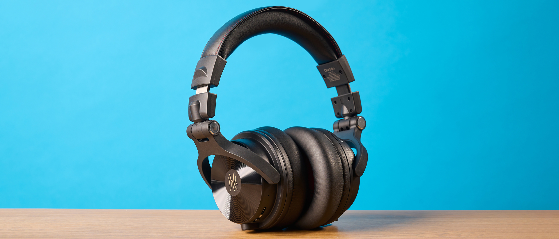 OneOdio Studio Max 2 in black photographed in front of a blue background