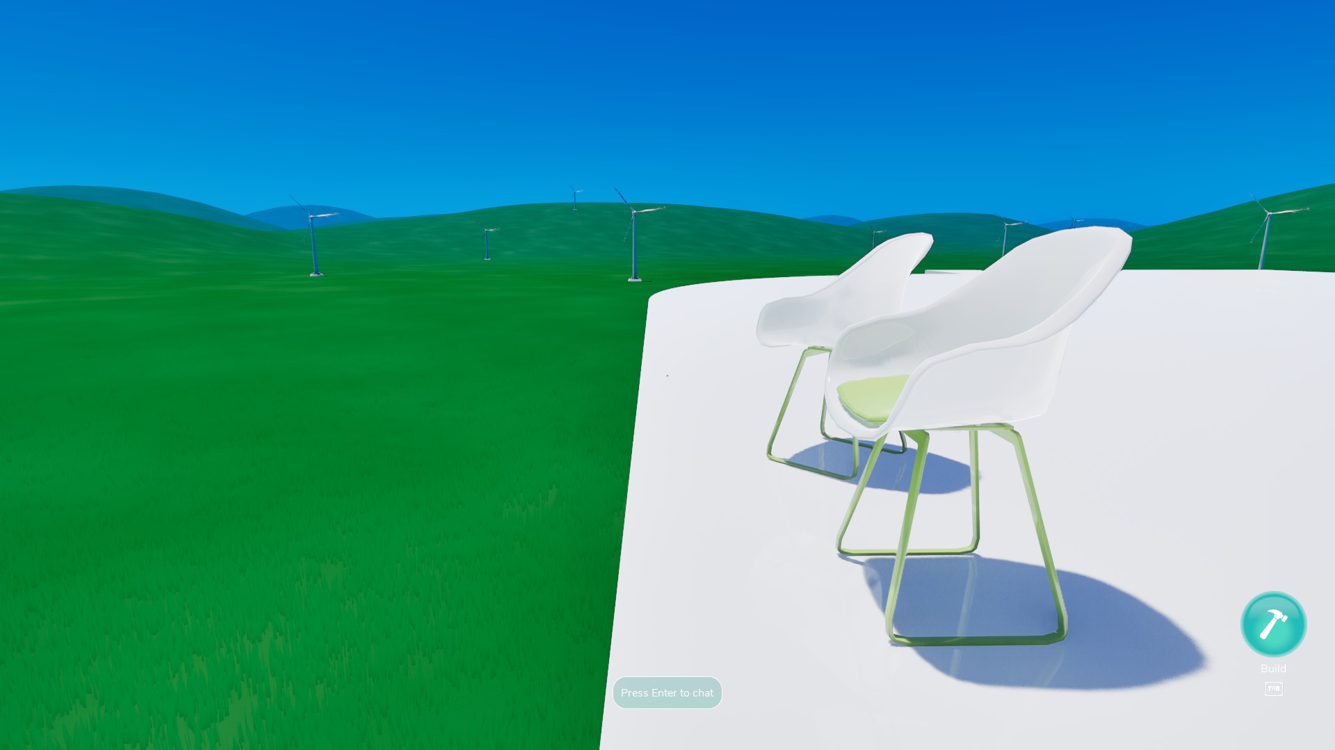 Two chairs placed atop a house, looking into the infinite green expanse in Frutiger Home.