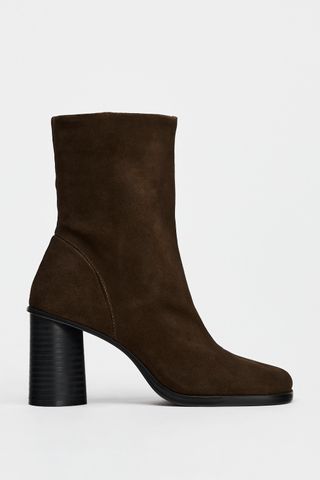 Suede Boots. Block Heels. Zip Closure. Rounded Toe. Heel Height: 3.1 Inches (8 Cm)