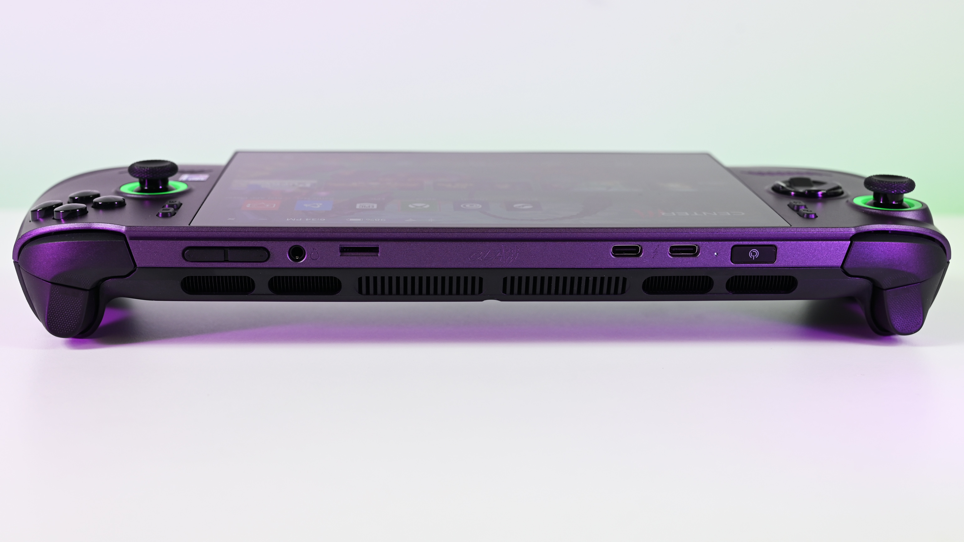 The top edge of the MSI Claw 8 EX AI+ showing cooling vents, two USB-C ports, a headphone jack, a microSD slot, and power and volume buttons.