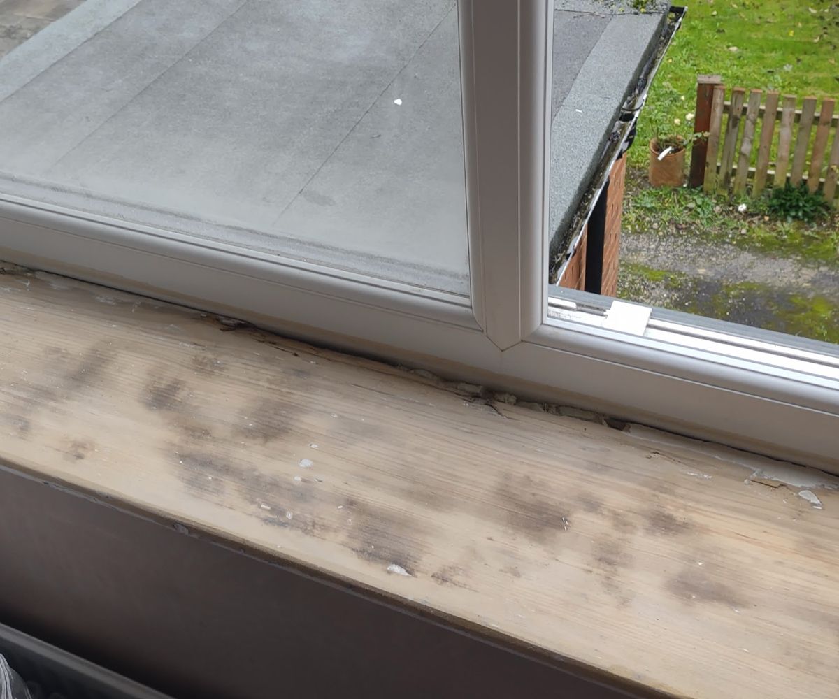 A windowsill after being sanded down to the bare wood