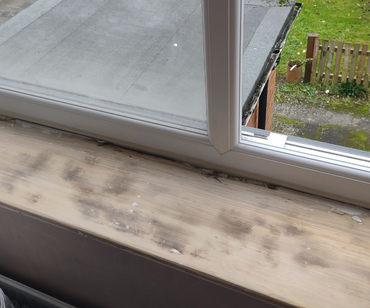 A windowsill after being sanded down to the bare wood
