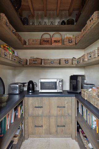 walk in pantry with microwave and small storage organisers