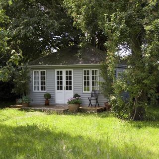 summerhouse with garden and white door