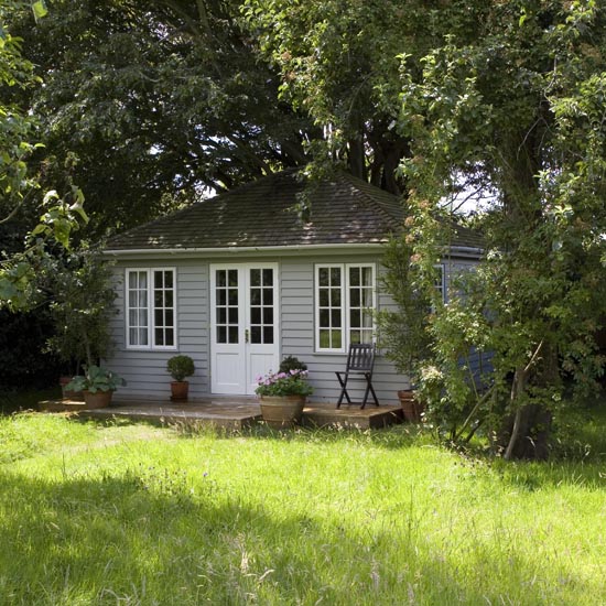 summerhouse with garden and white door