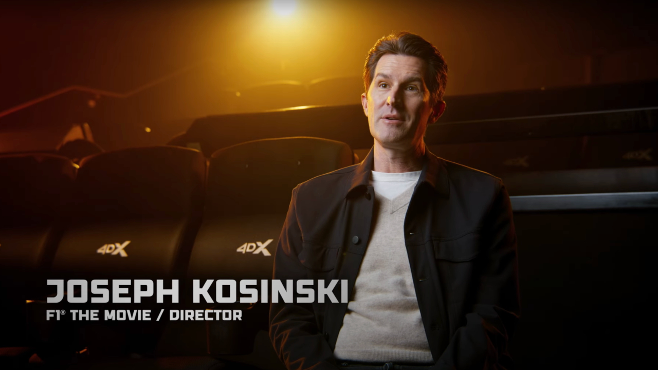 Joseph Kosinski pictured seated during a 4DX featurette in F1