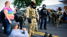 Federal agents confront protesters outside ICE facility in Portland, Oregon
