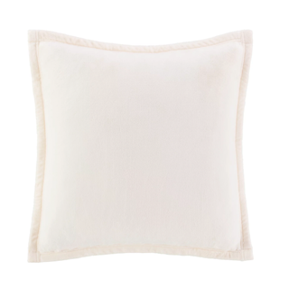 An UGG throw cushion in cream