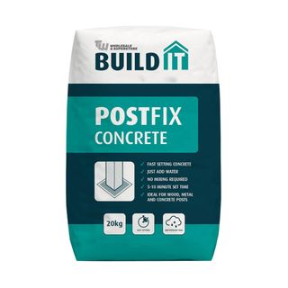 White, dark blue, and teal bag of cement with Build It logo and the name of the product on the front on a white background