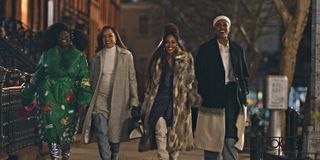 four women walk in a line through the streets of new york in the tv show harlem