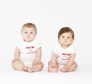 two babies with name tags on