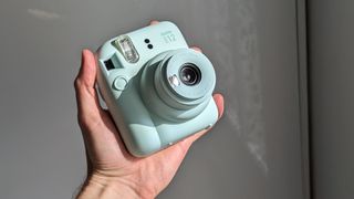 Fujifilm Instax Mini 12 instant camera in green; one of the best instant cameras