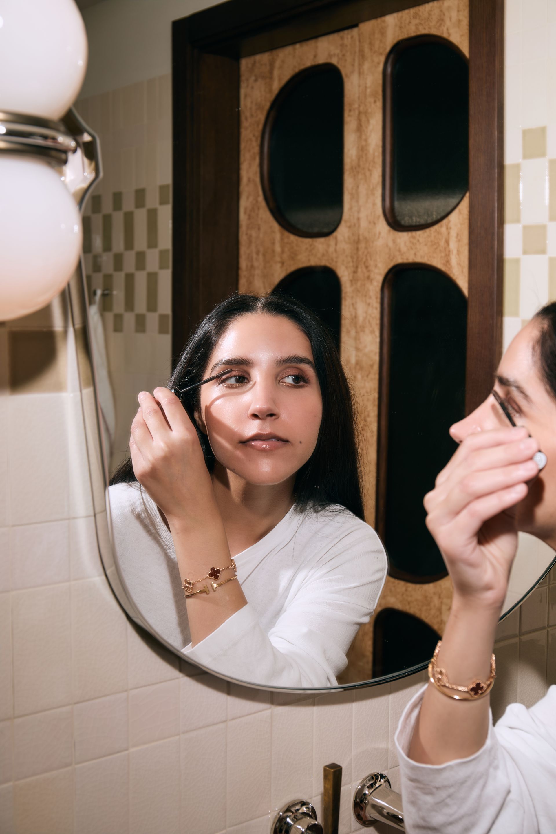 Who What Wear UK junior branded content editor Humaa Hussain testing a Merit mascara