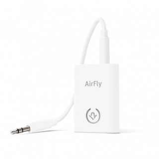 A front view of the AirFly wireless transmitter. It's a small, rectangular, white device with a white cable coming out of it that you can plug into a headphone jack.