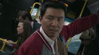 Simu Liu as Shang-Chi on San Francisco bus in Legend of the Ten Rings action sequence. 