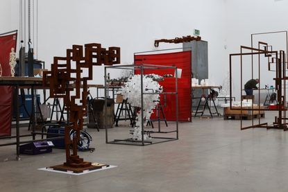 Inside the London studio of Antony Gormley featuring sculptures in progress