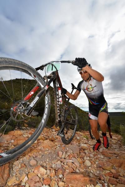 Marathon World Champion, Christoph Sauser of Specialized Racing, pushes his bike up a loose, rocky climb on his way to second place overall at the Attakwas Extreme marathon on Saturday.