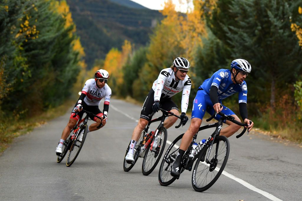 SALLENT DE GLLEGO SPAIN OCTOBER 25 Mattia Cattaneo of Italy and Team Deceuninck QuickStep Jasha Sutterlin of Germany and Team Sunweb Sergio Henao Montoya of Colombia and UAE Team Emirates Forest Autumn during the 75th Tour of Spain 2020 Stage 6 a 1464km stage from Biescas to Sallent de Gllego Aramn Formigal 1790m lavuelta LaVuelta20 La Vuelta on October 25 2020 in Sallent de Gllego Spain Photo by David RamosGetty Images