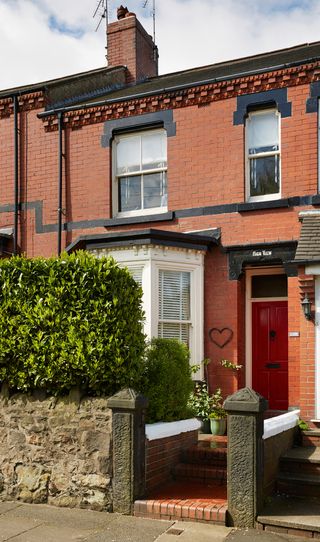 Pretty Victorian terraced house with decorative brick and terracotta detailing
