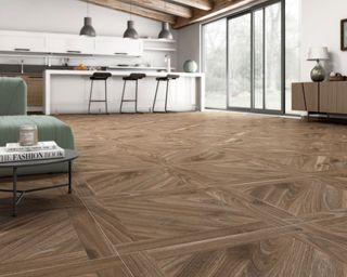 kanna nogel parquet wood effect tiles in a modern kitchen with kitchen island, seating area and coffee table - Tile Mountain