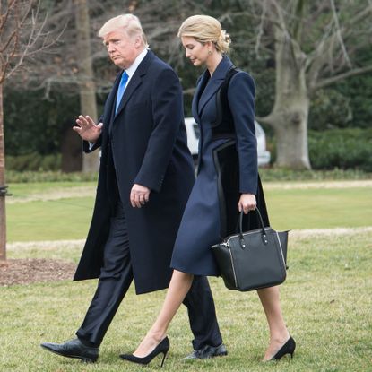 Standing, Fashion, Outerwear, Suit, Formal wear, Coat, Footwear, Tuxedo, Blazer, Shoe, 