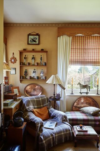 armchair with lamp in cottage living room