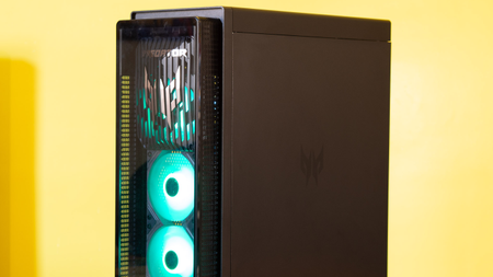 Acer Predator Orion 7000 gaming desktop PC on a wooden desk and yellow background