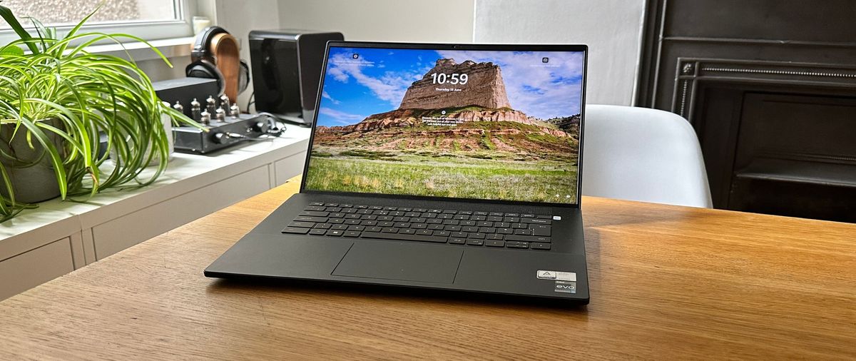 An open Dell Inspiron 16 Plus 7620 sitting on a wooden table