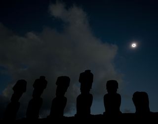 The sun is seen partially covered by the moon on Easter Island, 3700 km off the Chilean coast in the Pacific Ocean, on July 11, 2010. A total solar eclipse began its 11,000 kilometer (6,800 mile) arc over the Pacific Sunday, plunging remote islands into darkness in a heavenly display set to climax on Easter Island.