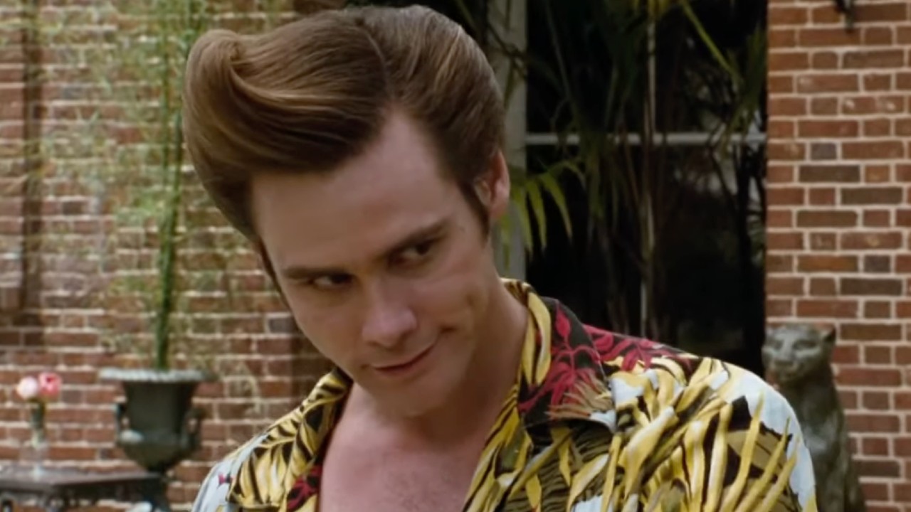 Ace Ventura making a devious face